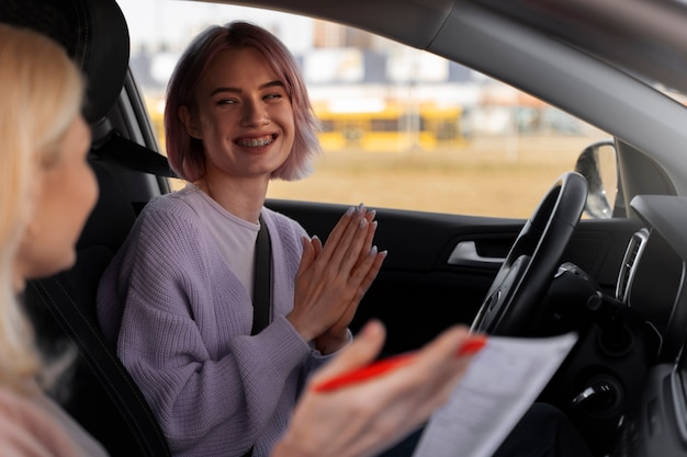 Woman taking her driver's license test in vehicle