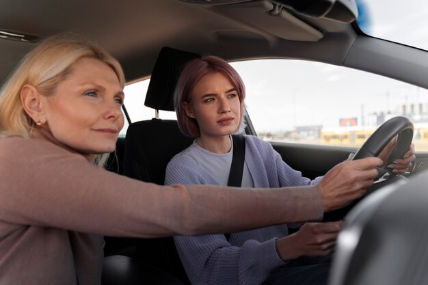 Woman taking her driver's license test in vehicle