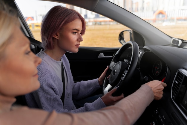 Woman taking her driver's license test in vehicle