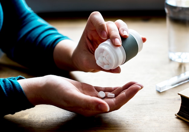 Woman taking medicine