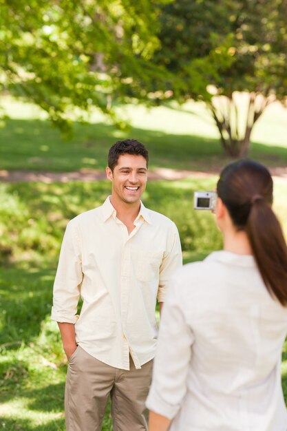 Woman taking a photo of her boyfriend