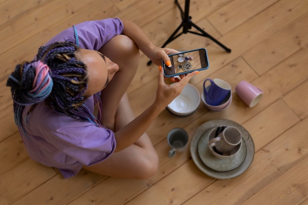 Woman taking photos for her business