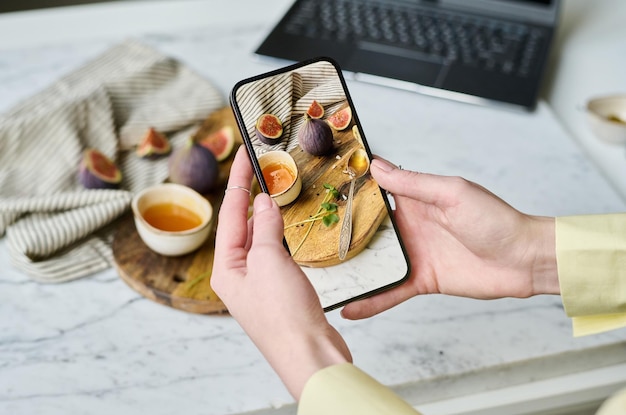 Woman taking pictures of still life