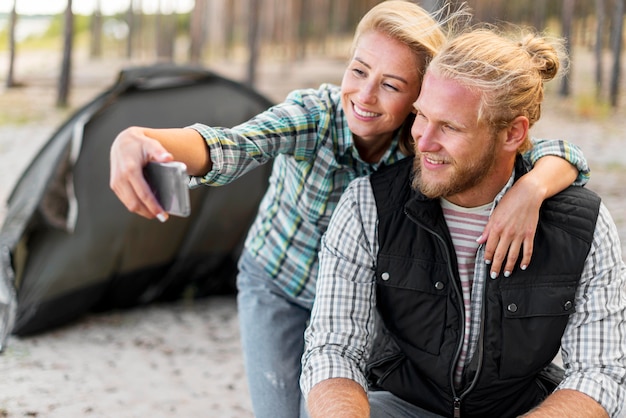 Woman taking a self photo with her boyfriend