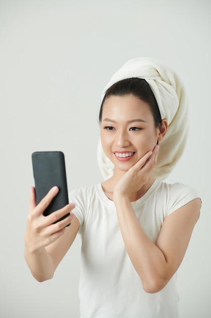 Woman Taking Selfie after Shower