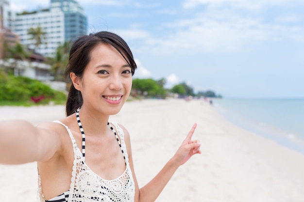 Woman taking selfie in beach