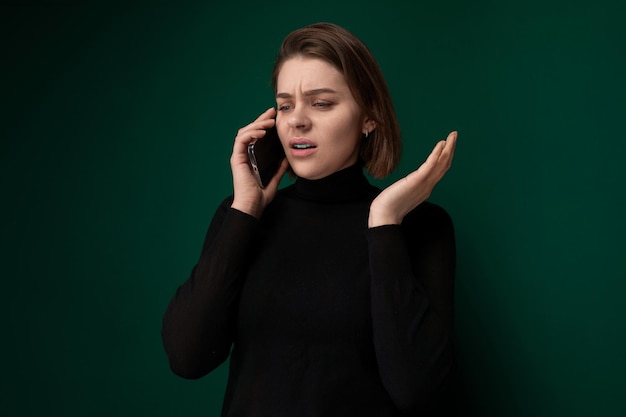 Woman talking on cell phone in black shirt