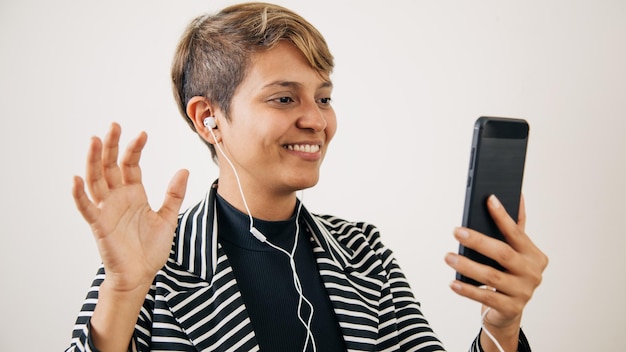 Woman talking on cell phone waving