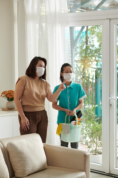 Woman Talking to Cleaning Service Worker