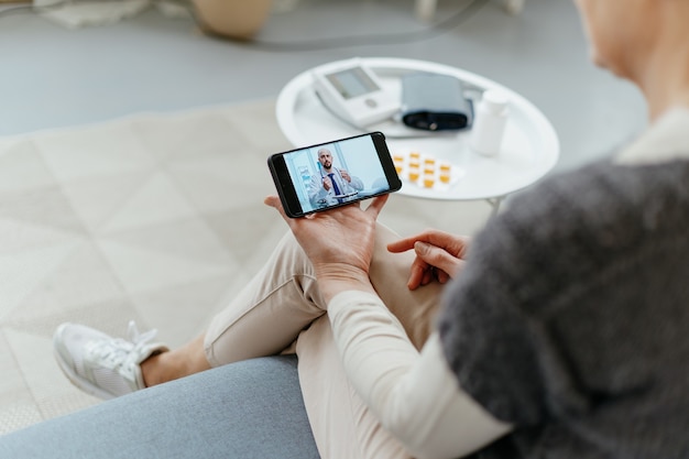 Woman talking to a doctor in a video chat