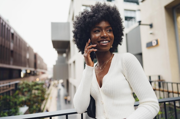 Woman talking on mobile phone in the city