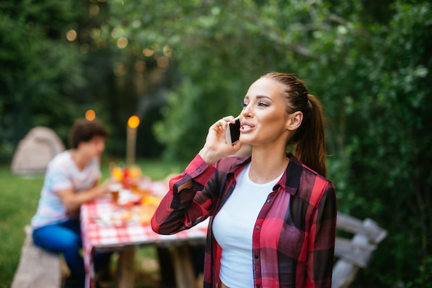 Woman talking on a mobile phone outdoors