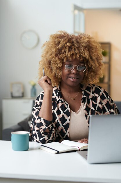 Woman talking online using laptop