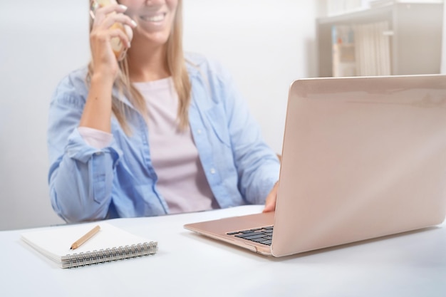 Woman talking on the phone on the office