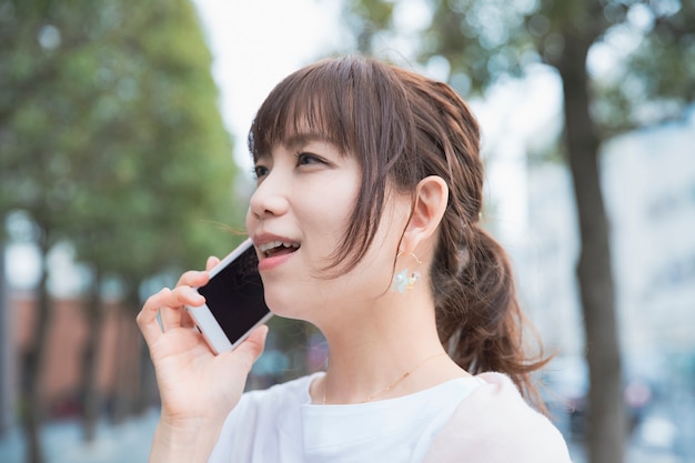 A woman talking on a smartphone