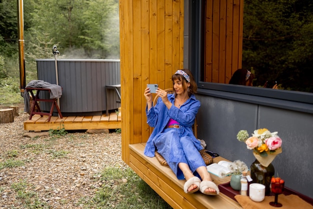 Woman on terrace of a house on nature