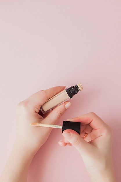 Woman testing foundation tone on hand