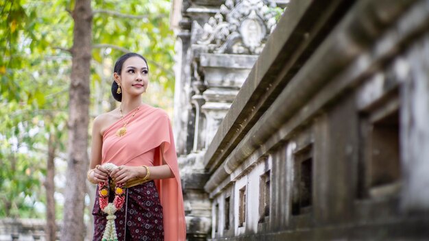 woman on Thailand traditionally costume posed outdoor