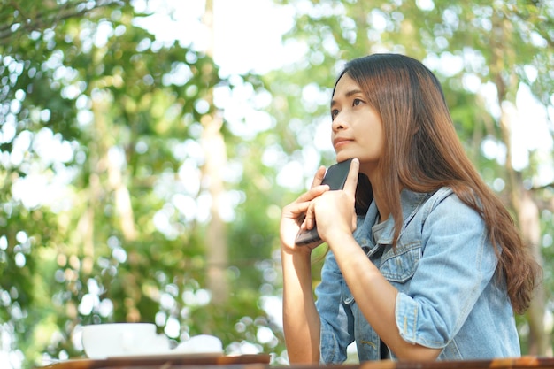 Woman thinking hard as profits decline in coffee cafe