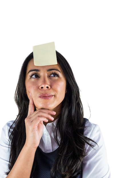 Woman thinking with a post it on her head