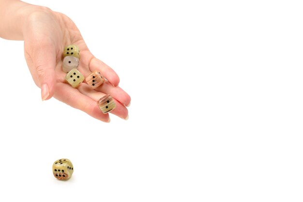 Woman throws dices isolated on white.