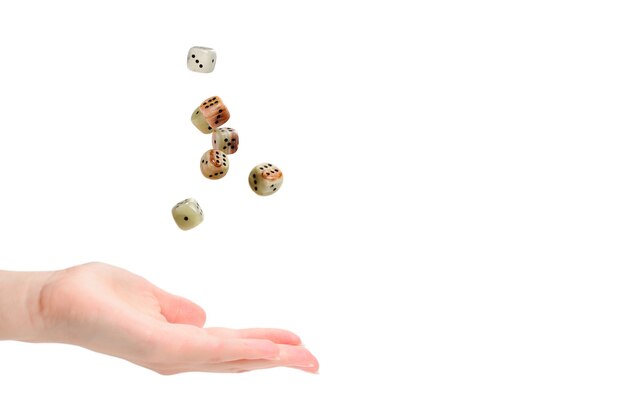 Woman throws dices isolated on white.