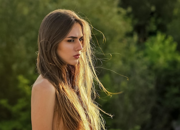 Woman topless with hair covered her bare chest healthy and beautiful hair girl has long brunette hair fashion and beauty sexy woman relax outdoor pure desire makeup and cosmetics copy space