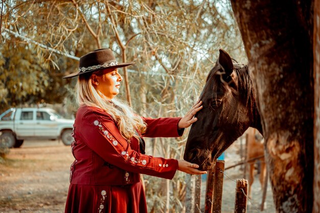 Woman touching horse's mane