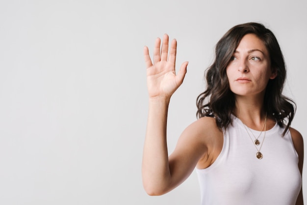 Woman touching a screen with her palm