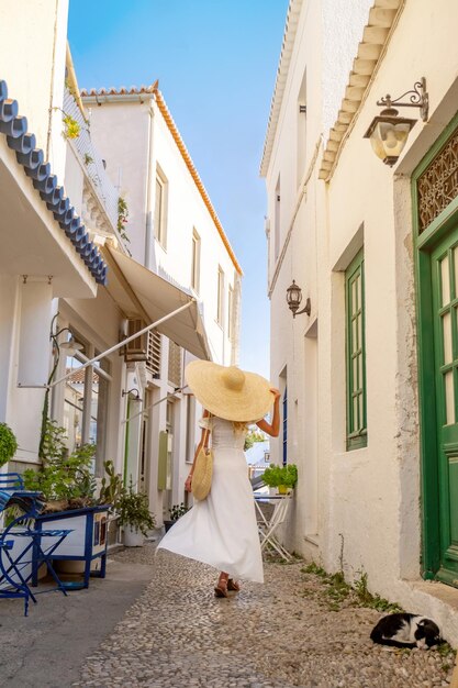 Woman tourist walking the streets of a old greek city