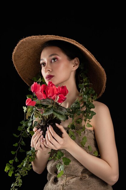 Photo woman transplanted flower in a ceramic pot houseplant transplant concept