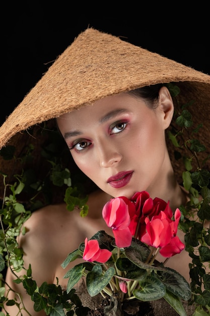 Woman transplanted flower in a ceramic pot Houseplant transplant concept