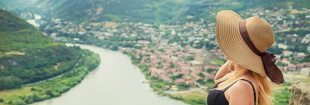 Woman traveler on the of the attractions of Georgia.