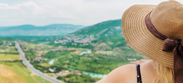 Woman traveler on the of the attractions of Georgia.