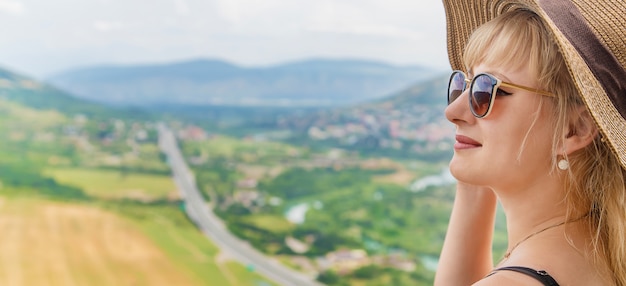 Woman traveler on the of the attractions of Georgia.