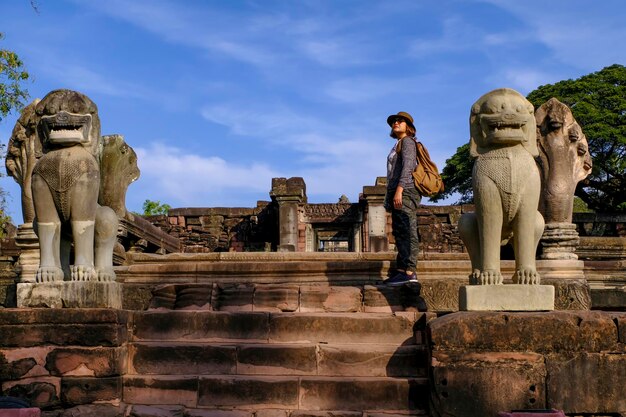 A woman traveler visited ancient temple architecture and building in northeast of thailand