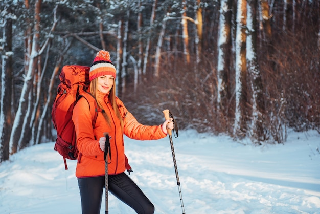 Woman Traveler with backpack hiking Travel Lifestyle adventure  active vacations outdoor. Beautiful landscape  forest