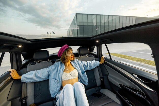 Woman travels by car at city