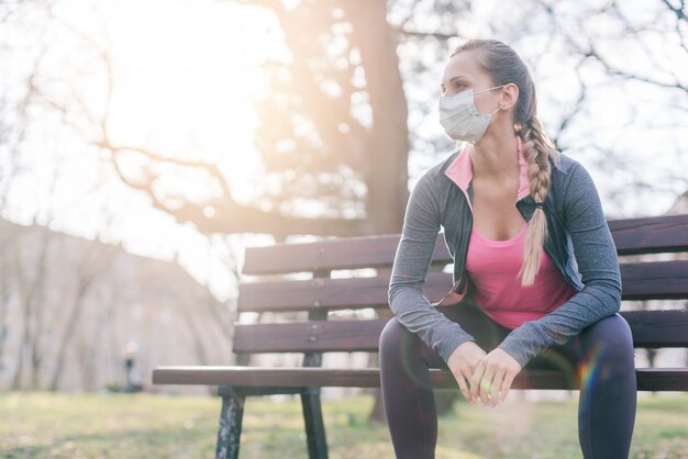 Woman trying to do sport during coronavirus crises despairing of the world