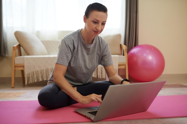 Woman turning on exercise video