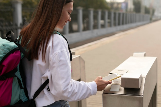 Woman at the turnstiles