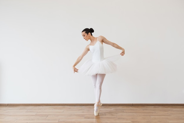 Woman in tutu motion balance flexibility concept lifestyle