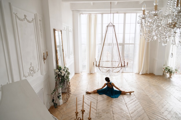 Woman in twine in a beautiful elegant hall