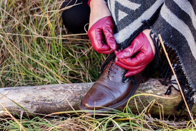 Woman tying shoelace on shoes