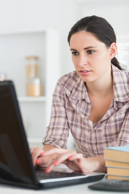 Woman typing on a computer