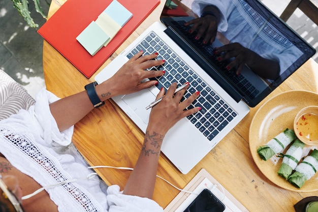 Woman typing on laptop computer