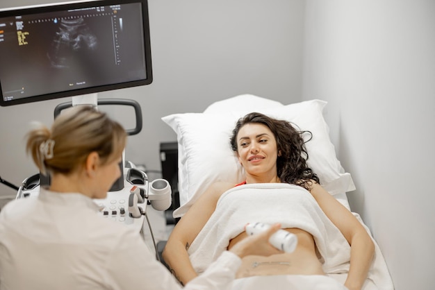 Woman during an ultrasound examination of abdominal cavity