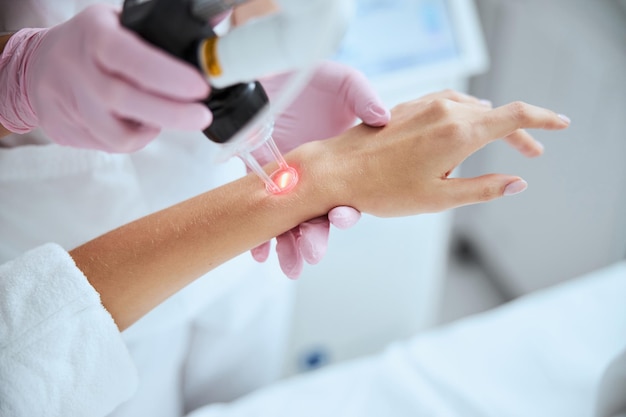 Woman undergoing the cosmetic procedure in a beauty clinic