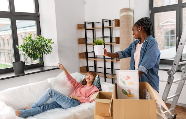 woman unpacking boxes and moving to new home
