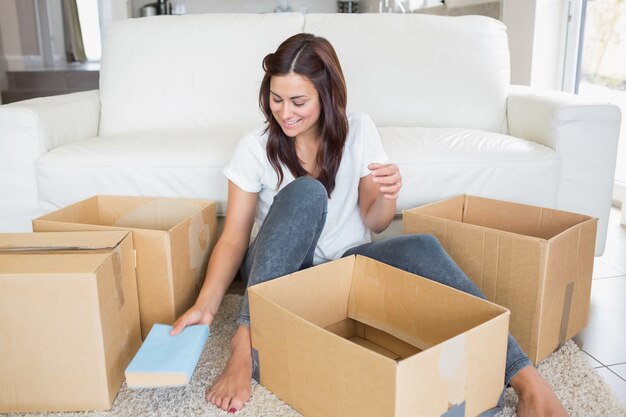 Woman unpacking boxes